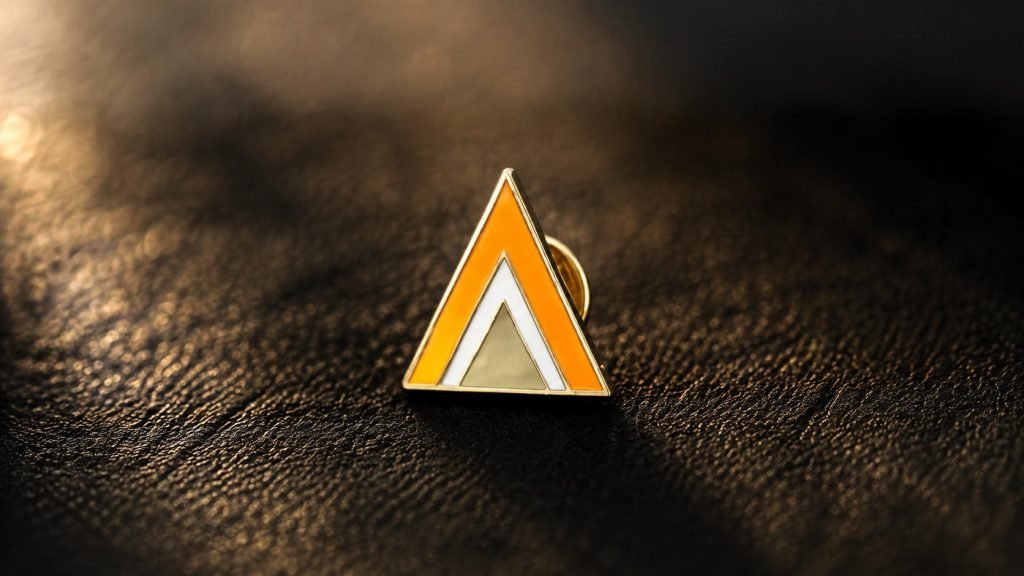 Geometric Orange Triangle Enamel Pin — front display view