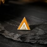 Geometric Orange Triangle Enamel Pin — presentation view