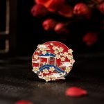 Red Pavilion and Blossom Enamel Pin — front display view